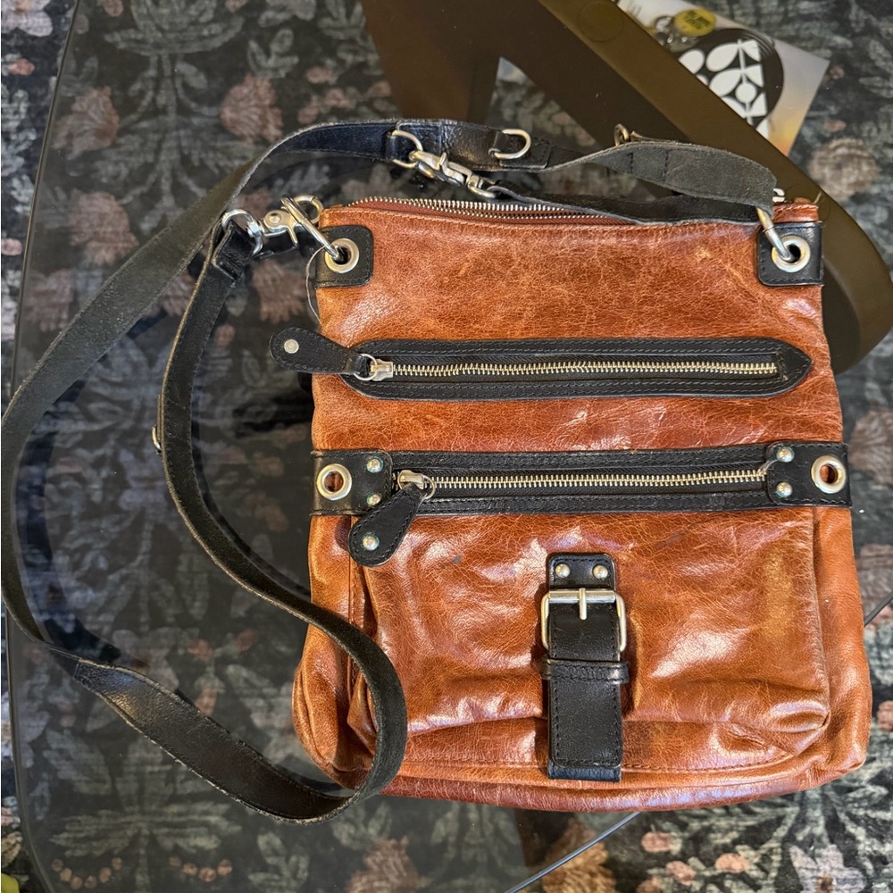 TANO Black and Brown Crossbody Buckle Bag. Adjustable strap.
